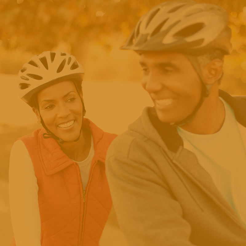 A photo of a couple on a bicyle tinted yellow